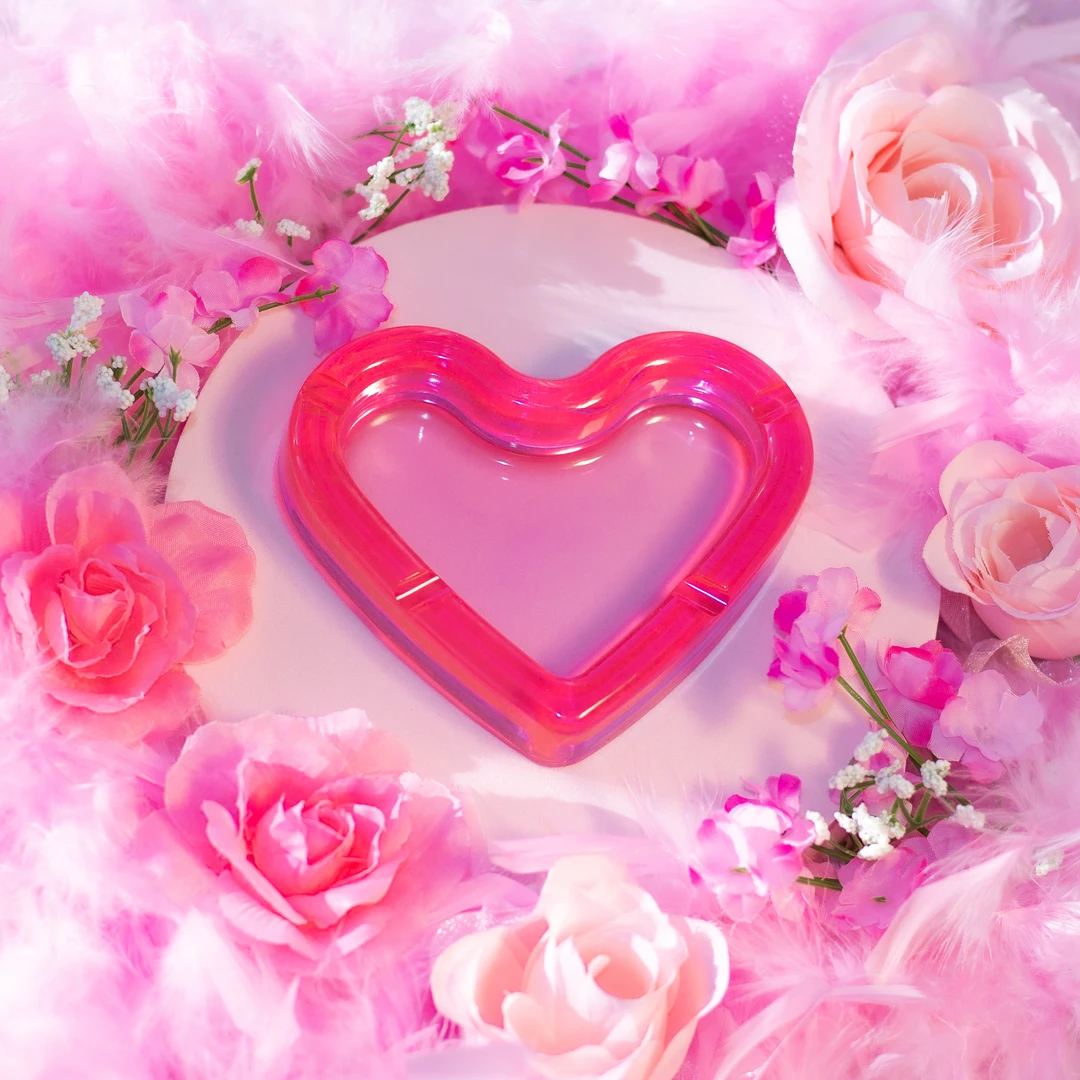 Pink heart-shaped resin ashtray with cigarette holders