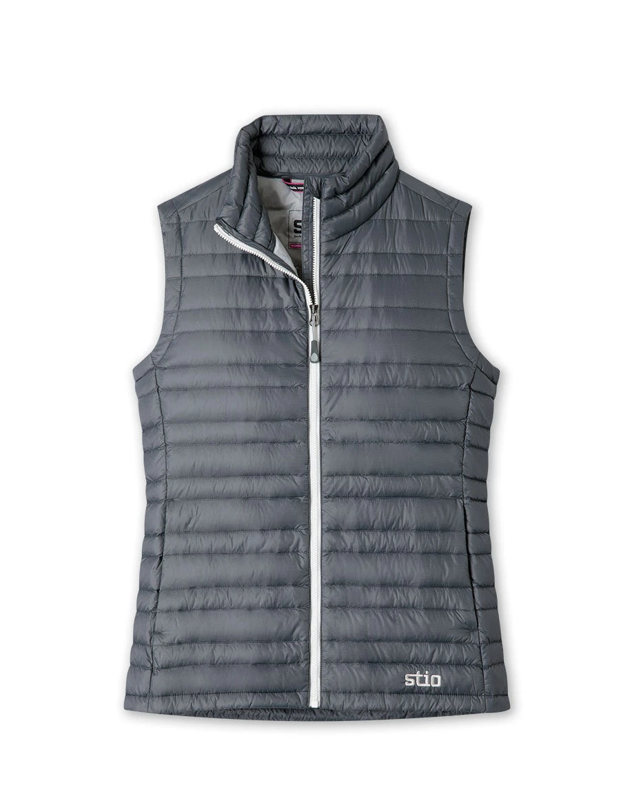 Stio Women's Pinion Down Vest in mountain setting