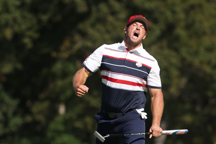 Bryson DeChambeau reacts after hitting a crucial putt on the 12th hole Sunday.