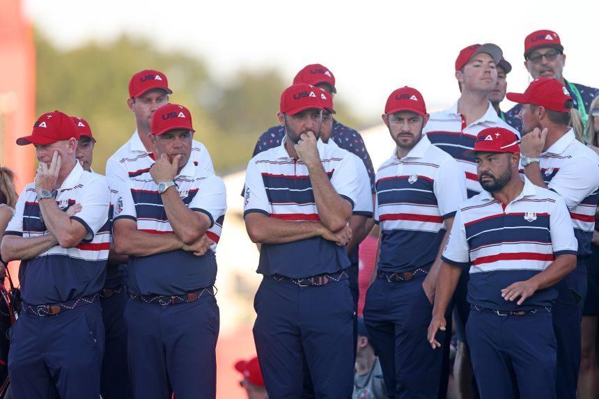 Members of Team USA stand together on the last hole shortly after losing on Sunday.